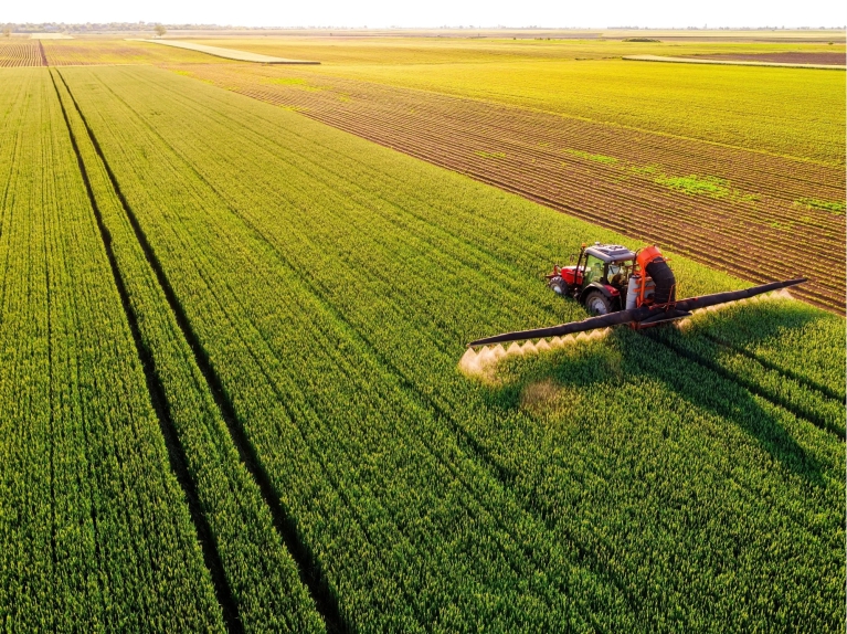 A tractor working on a farm field