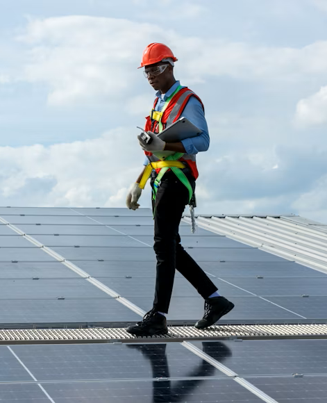 A man walking on solar panels