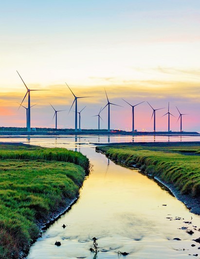 An image of a wind turbine near a river